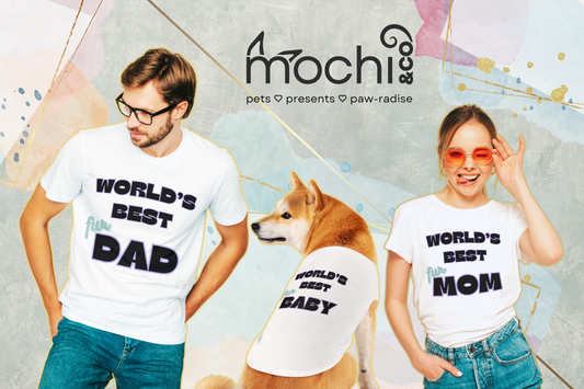 a man wearing a shirt saying "world's best fur dad", a dog wearing a tank top saying "world's best fur baby", and a woman wearing a shirt saying "world's best fur mom" all by mochi & co